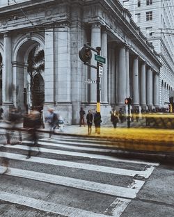 People walking on road in city