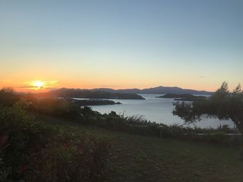 Scenic view of lake against sky during sunset