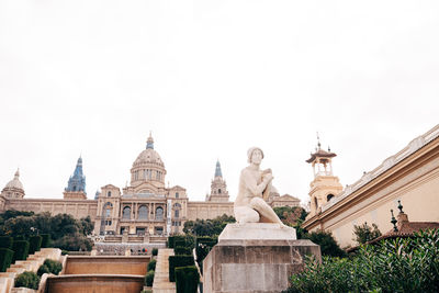 Statue of historic building against clear sky