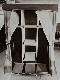 Close-up of chairs on table