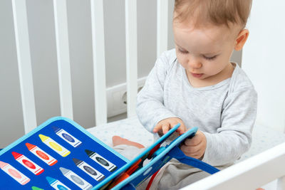 Boy playing with toy blocks