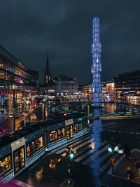 High angle view of illuminated buildings in city at night