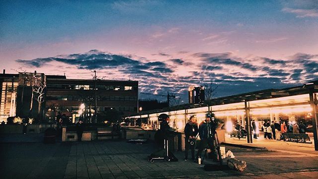 large group of people, person, lifestyles, illuminated, men, sky, architecture, building exterior, built structure, leisure activity, city life, city, crowd, street, mixed age range, night, transportation, cloud - sky, outdoors