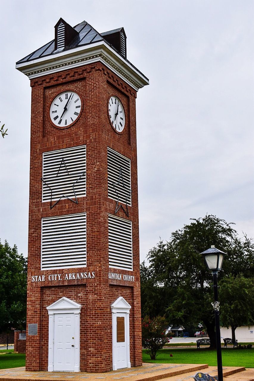 clock, time, sky, building exterior, architecture, outdoors, low angle view, built structure, no people, street light, day, cloud - sky, tree, clock tower, clock face, minute hand