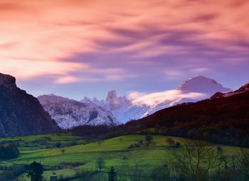 Scenic view of field against sky during sunset