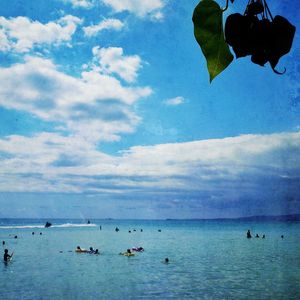 Scenic view of sea against cloudy sky