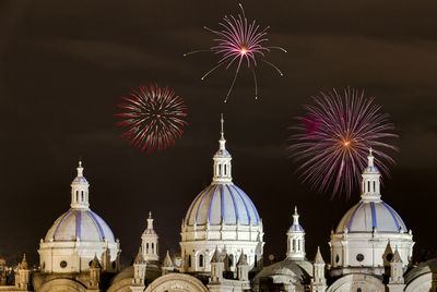 Low angle view of firework display against sky at night