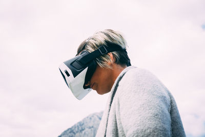 Portrait of man wearing sunglasses against sky