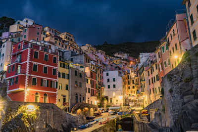 Town against sky at night