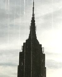 Low angle view of cathedral against cloudy sky