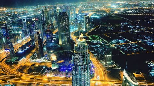 Aerial view of illuminated cityscape at night