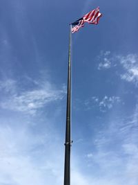 Low angle view of flag against sky