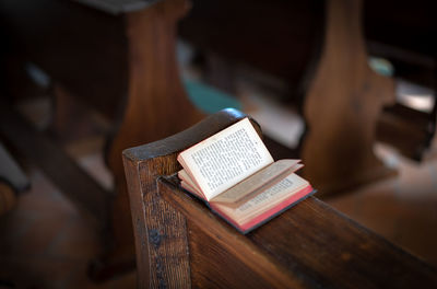 High angle view of book on pew at church