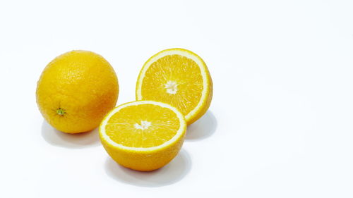 Close-up of fruits against white background