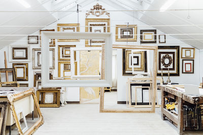 Variety of frames hanging in workshop