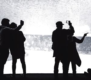 People photographing at aquarium