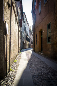 Narrow alley amidst buildings in city