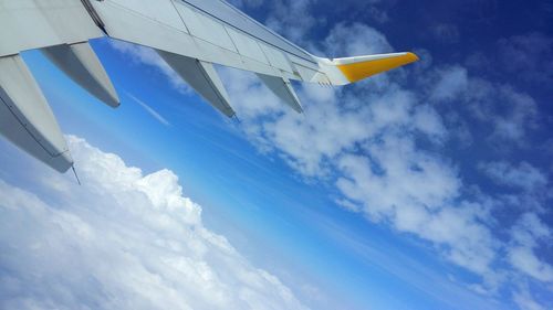Low angle view of airplane against sky