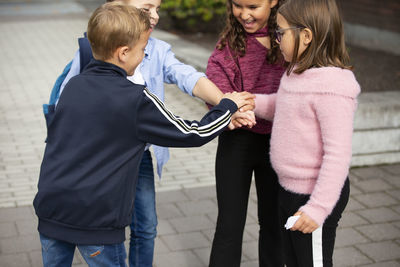 Children with hands together