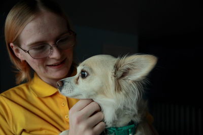 Close-up of woman with dog