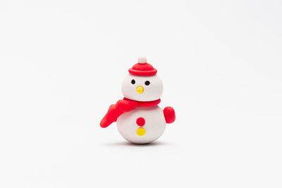 Close-up of toy figurine against white background