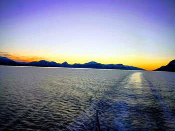 Scenic view of sea against clear sky during sunset