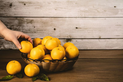 Man holding fruits on table