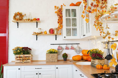 Autumn kitchen with decorations and pumpkins, thanksgiving day 