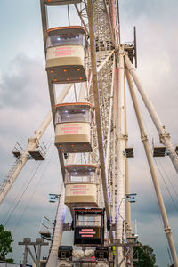 Low angle view of ferris wheel against sky