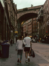 Rear view of woman walking on street