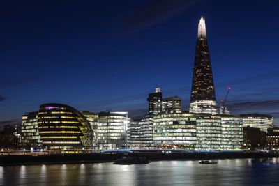 Illuminated buildings in city at night