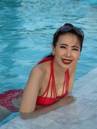 Portrait of smiling mature woman in swimming pool