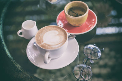 Close-up of cappuccino served on table