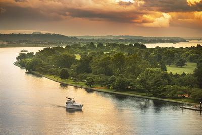 Scenic view of river against sky during sunset