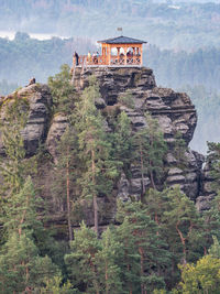 Breakfast or picnic of tourists group on popular lookout mariina vyhlidka. bohemian switzerland park