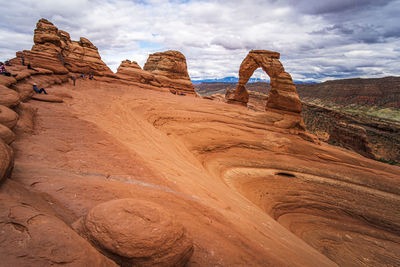 Rock formations on landscape against sky