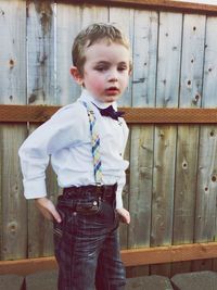 Boy standing on wooden floor