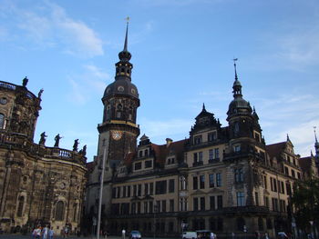 Low angle view of buildings in city against sky