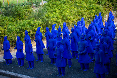 Group of people against blue sky