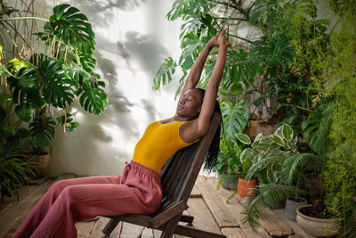 Young woman sitting on chair