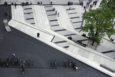 High angle view of people walking on road in city