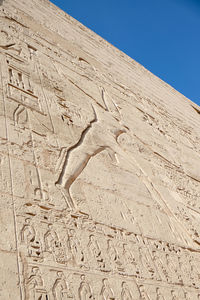 Carving on wall of egyptian temple.