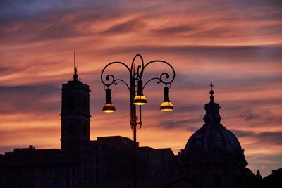 Low angle view of historic buildings in rome against sky during sunset