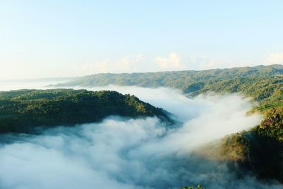 Scenic view of cloudscape on mossy mountain