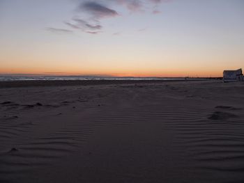 Scenic view of beach at sunset