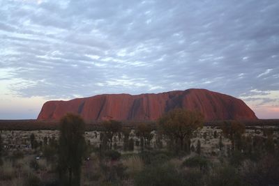 Scenic view of mountains against cloudy sky