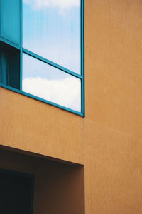 Low angle view of window on wall