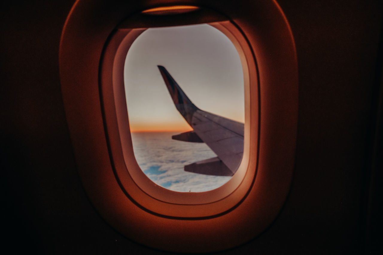 VIEW OF AIRPLANE THROUGH WINDOW
