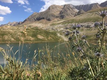 Scenic view of lake and mountains against sky