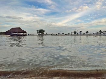 Scenic view of sea and buildings against sky